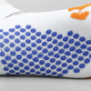 White cycling and running socks featuring a pattern of blue polka dots and orange accents.