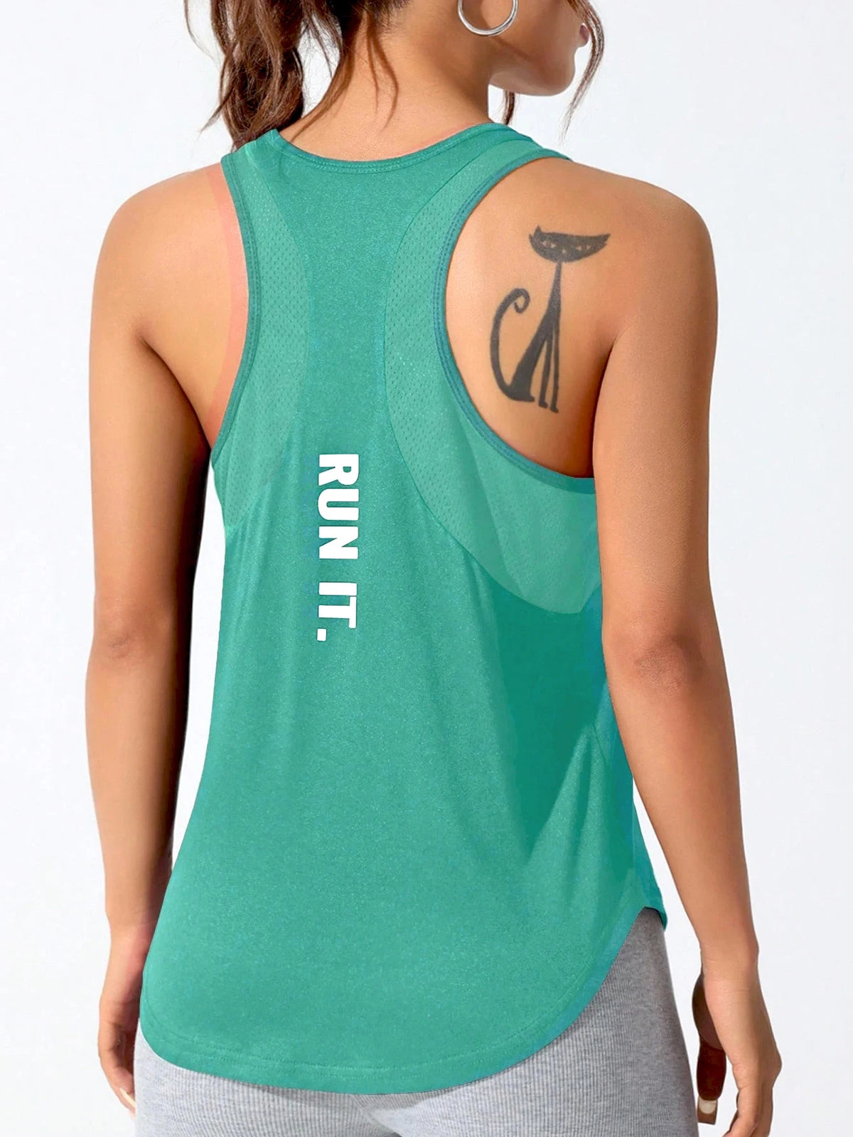 A teal running vest with a black cat silhouette design on the shoulder, worn by a person.