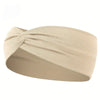 Beige knotted elastic sports headband worn on a person's head.