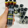 A bottle of Walker Tape Ultra Hold hair system adhesive next to several similar bottles.