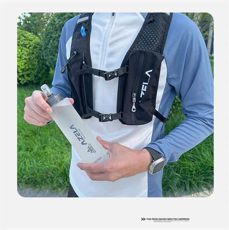 A person holds a black collapsible silicone water bottle against a white shirt, demonstrating the product.
