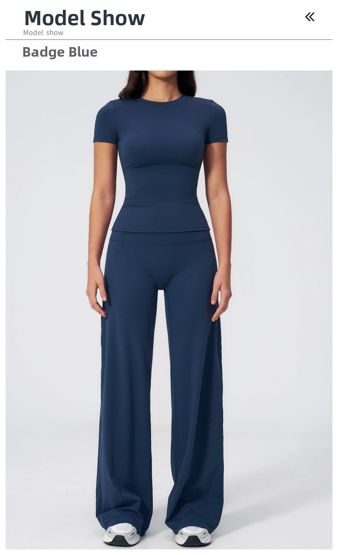 A model wearing a navy blue high-waist yoga and gym leggings set.