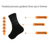 Black compression ankle support brace showing a gradual pressure gradient from top to bottom