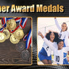 A display of gold, silver, and bronze award medals with ribbons, alongside a group of smiling female athletes.