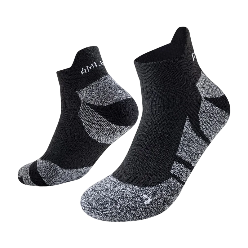 A pair of black performance sports ankle socks with a gray geometric pattern.
