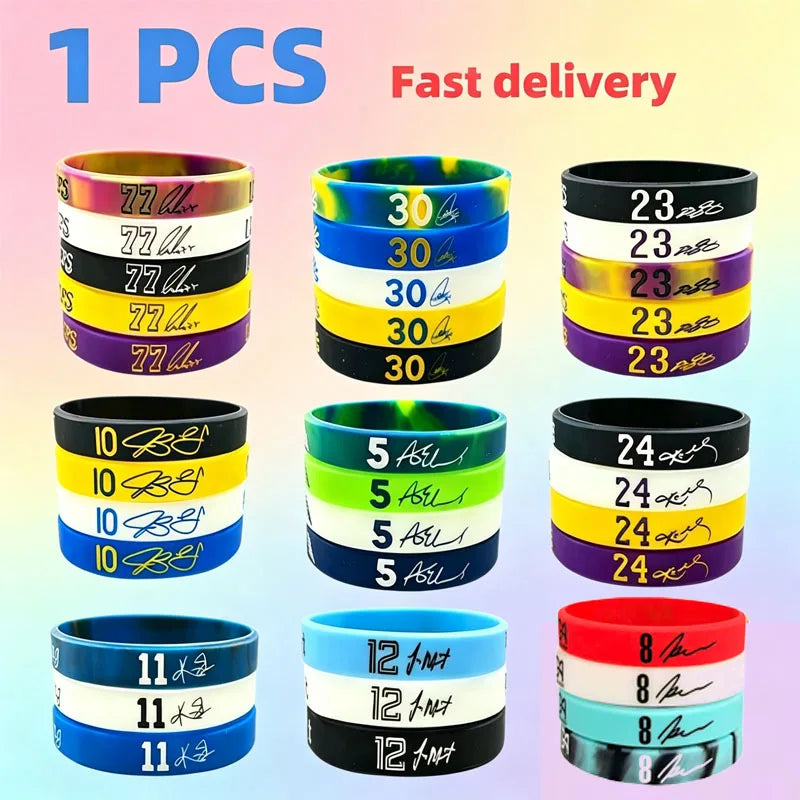 A collection of black, yellow, blue, and pink silicone wristbands for sports and fashion.
