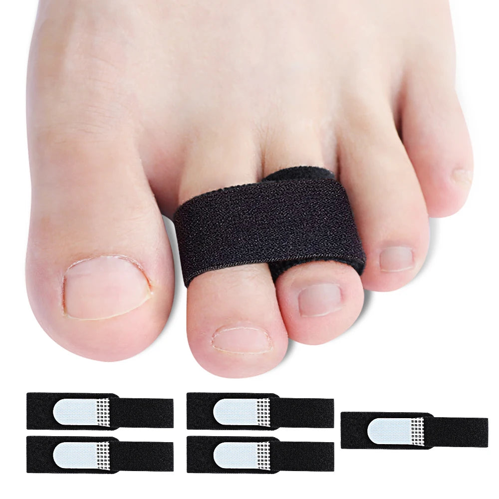 A hand shows several black orthopedic toe wraps designed for hammer and broken toes.