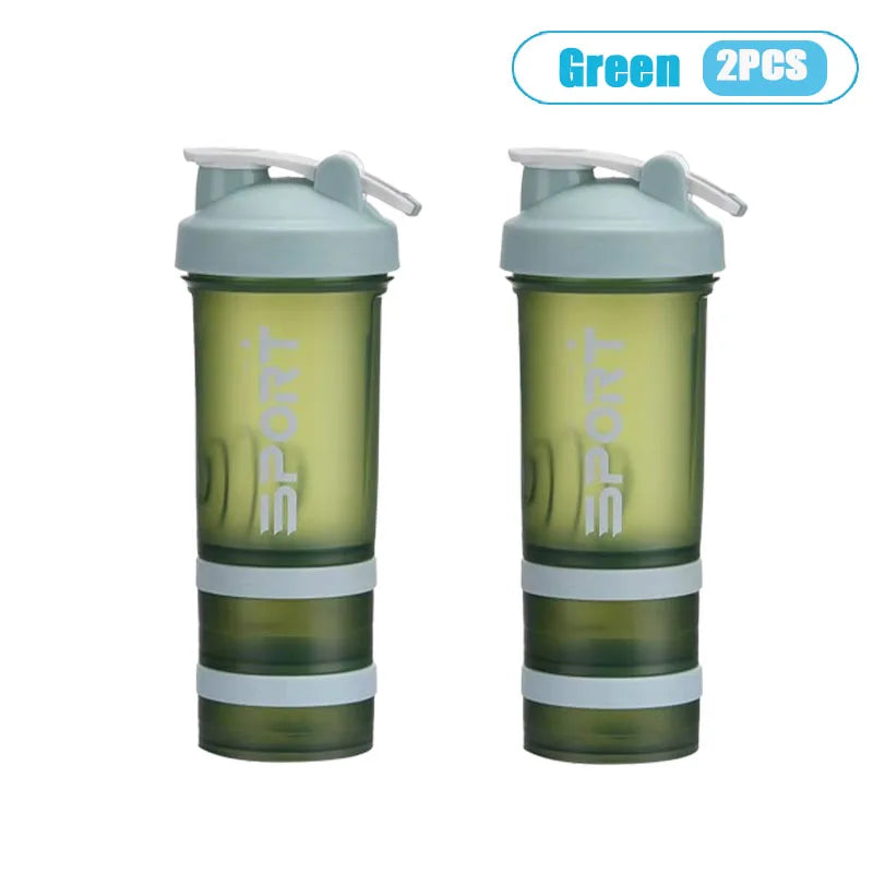 A pair of green 3-layer protein shaker bottles with handles shown side by side.