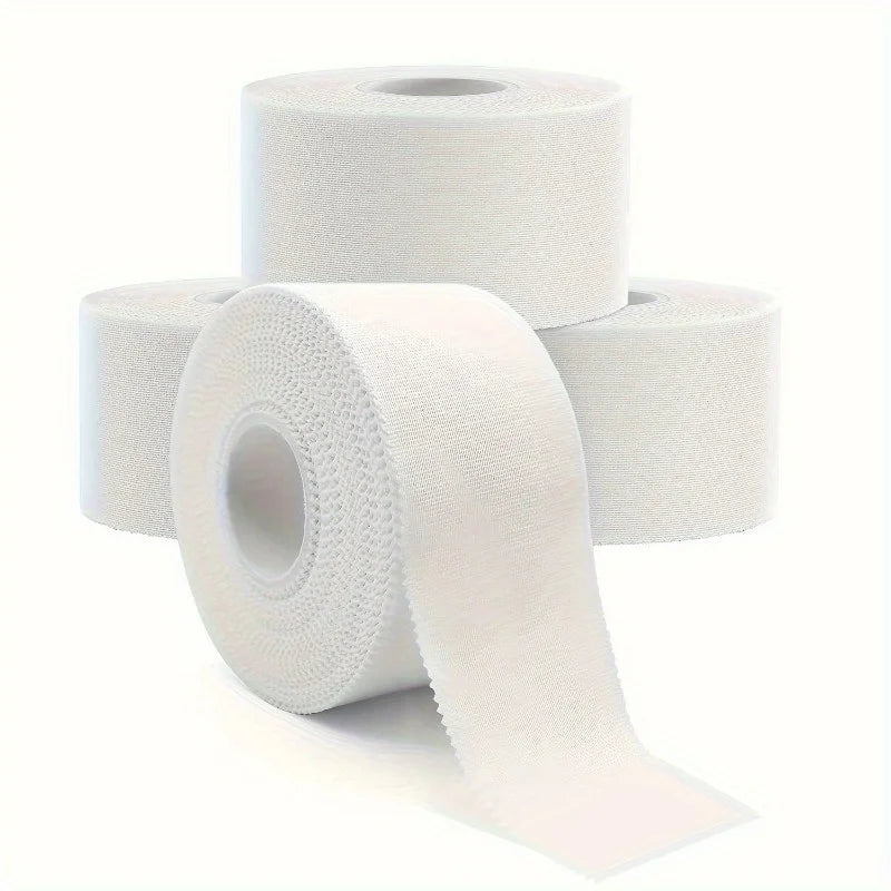 Rolls of white athletic training tape for injury support stacked and displayed