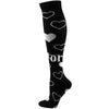 Black compression socks with white heart patterns