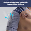 A close-up of an elastic breathable fabric shoulder support brace being worn on the arm.