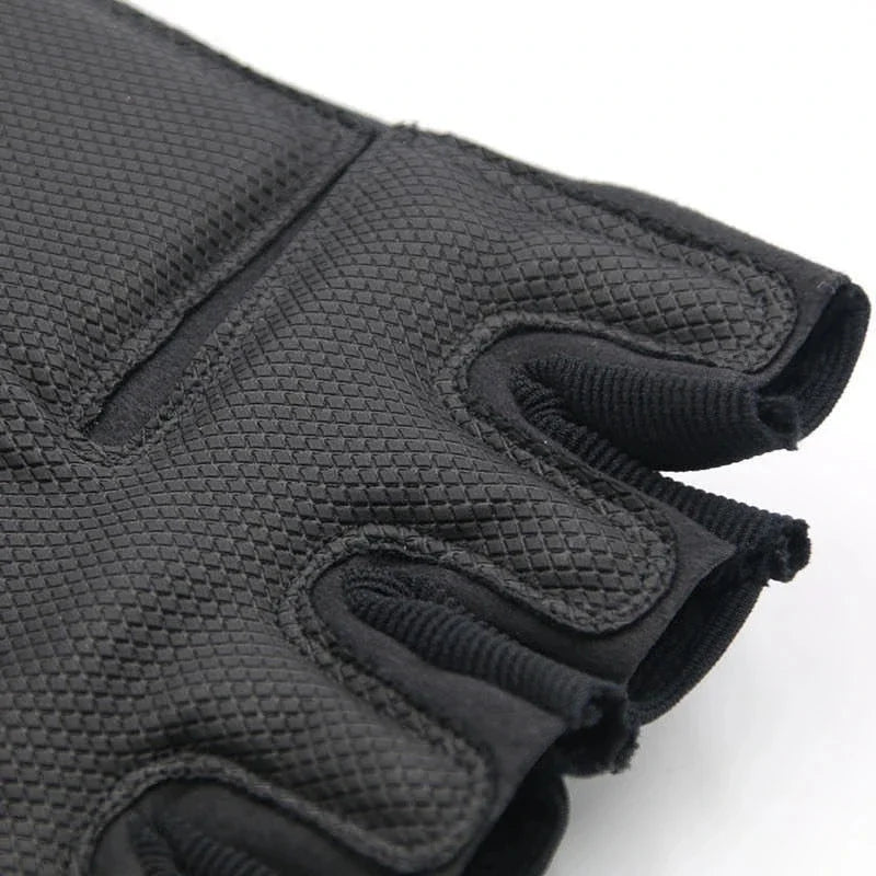 A close-up view of black half finger tactical gloves for sports and outdoor activities.