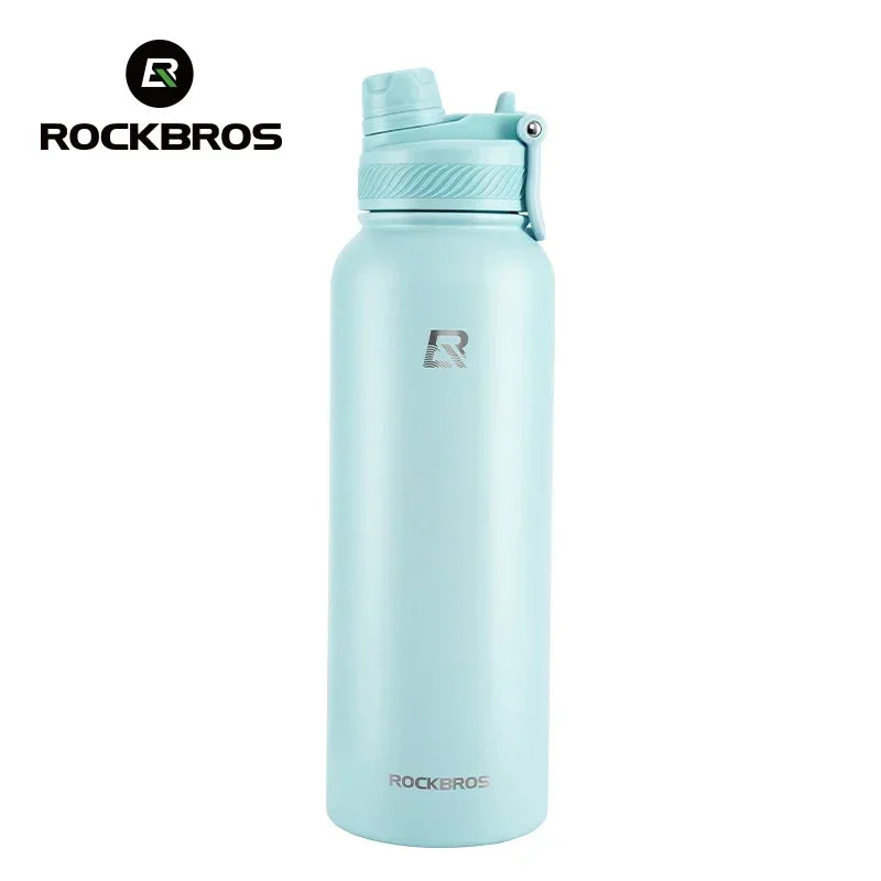A light blue insulated stainless steel thermal water bottle with a silver cap and logo.