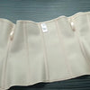 A beige double compression waist trainer corset body shaper displayed flat on a dark surface.