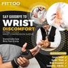 A man wearing a black copper fiber wrist compression sleeve for pain relief.