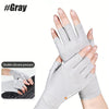 A hand wearing gray fingerless compression gloves for pain relief