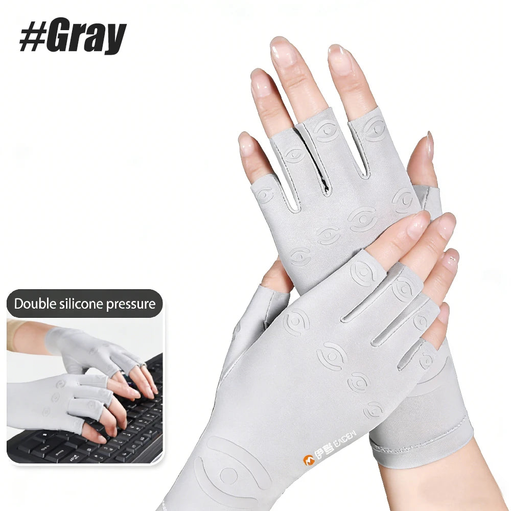 A hand wearing gray fingerless compression gloves for pain relief