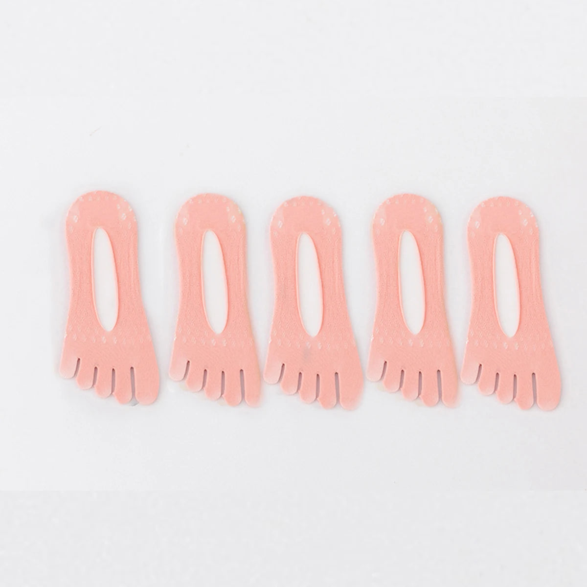 A pack of five ultra-thin, peach-colored invisible boat socks.