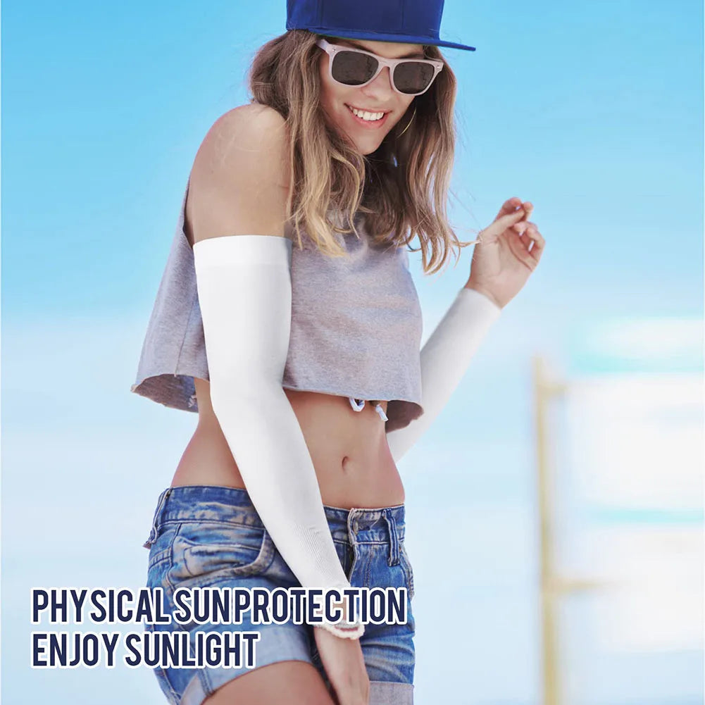 A woman wearing a blue hat and sunglasses is modeling white UV protection arm sleeves while enjoying sunlight.