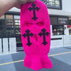 A bright pink tactical knit balaclava beanie hat featuring black cross embroidery.
