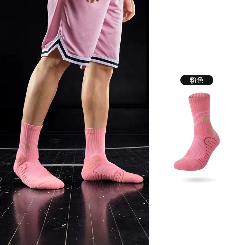 Pink performance basketball running socks shown on a person's leg.