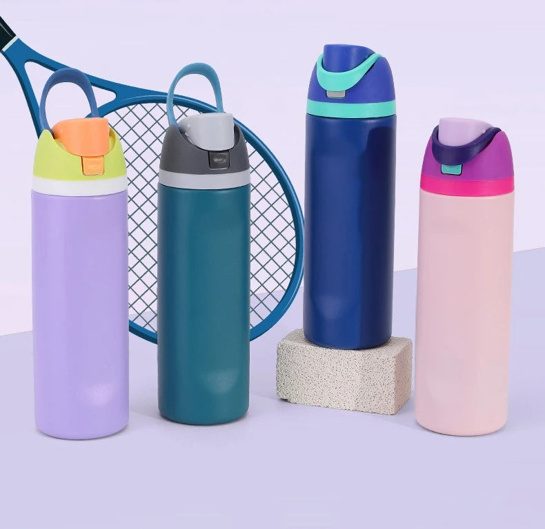 Three stainless steel insulated fitness cups in purple, teal, and pink with lids and straws displayed on a light surface.