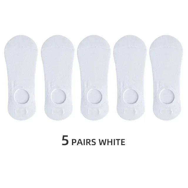 Five pairs of white men's invisible silicone no-show socks laid out side by side.