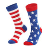 A pair of red, white, and blue striped flag socks with a blue star pattern on the foot.