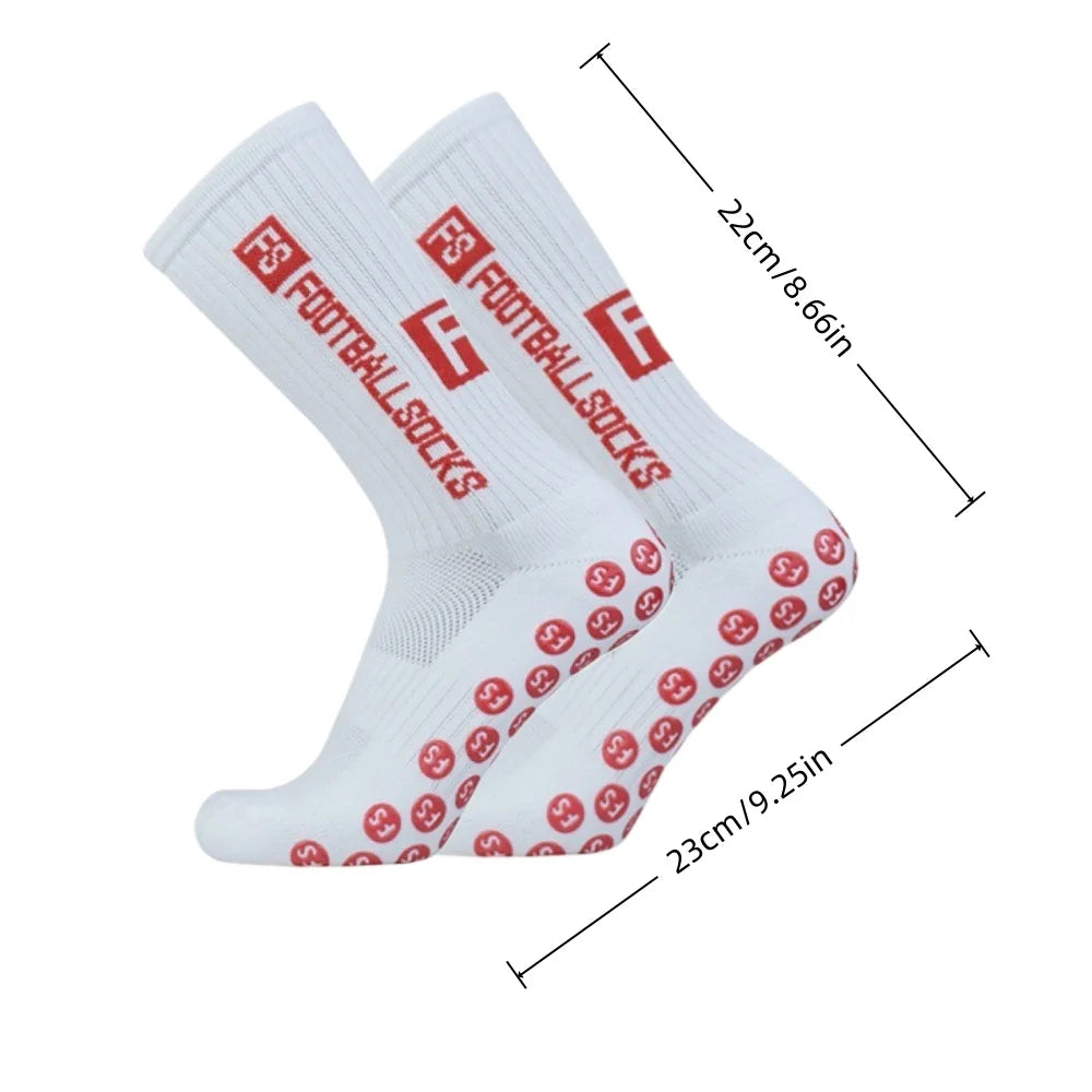 A pair of white football socks with red logos shown from the side, indicating their length and width.