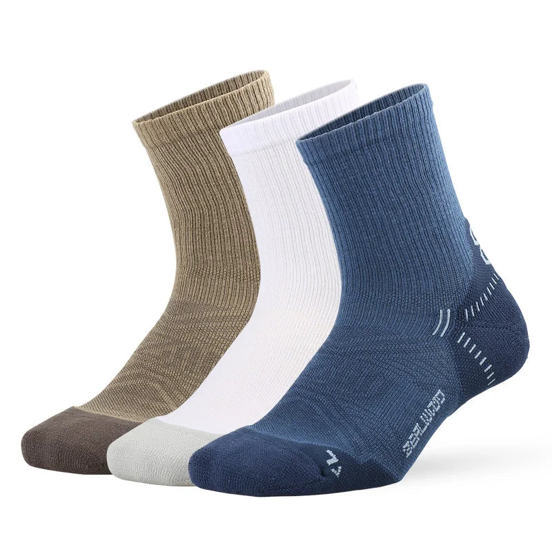 A stack of four breathable performance running socks in shades of beige, white, and navy blue.