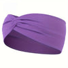 Purple knotted elastic sports headband worn on a head