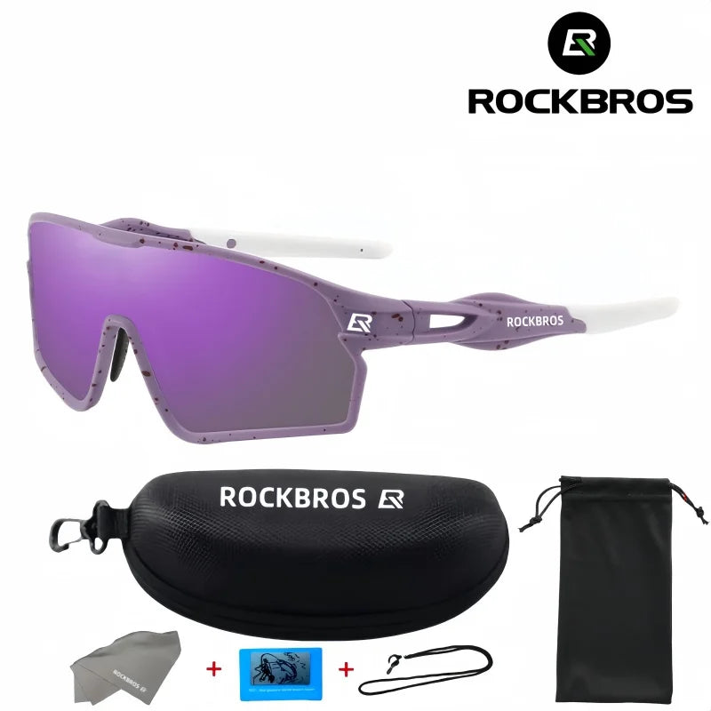 A pair of purple polarized cycling sunglasses with white accents and a black protective case are shown.
