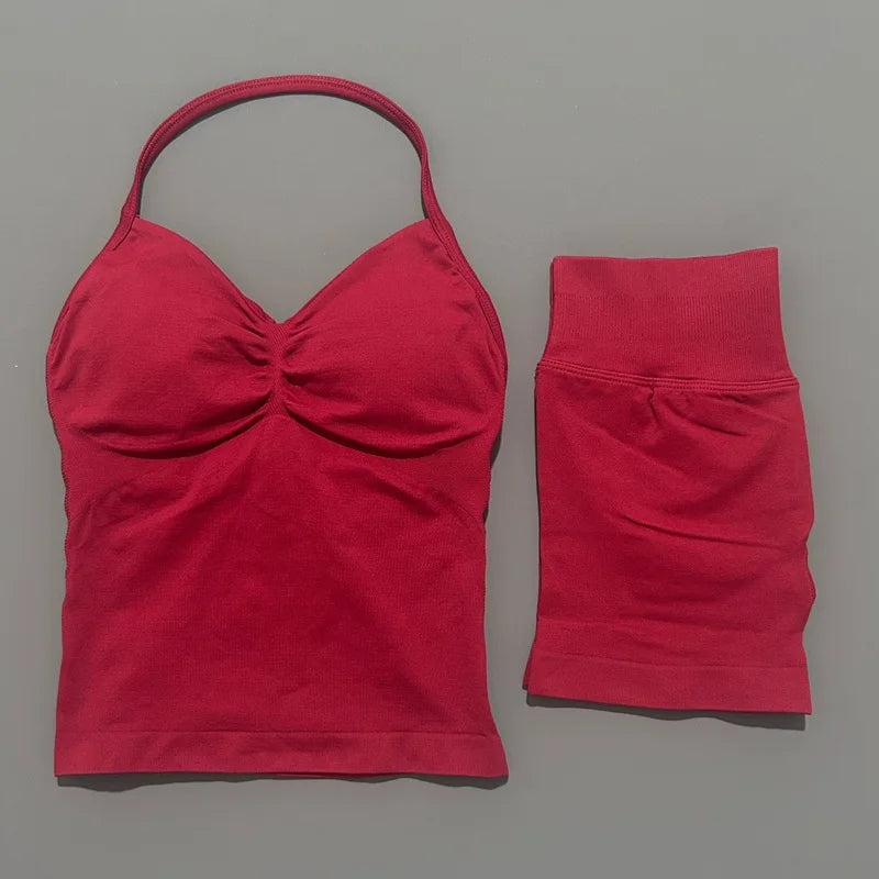 A red women's seamless backless fitness set top and bottom shown flat.
