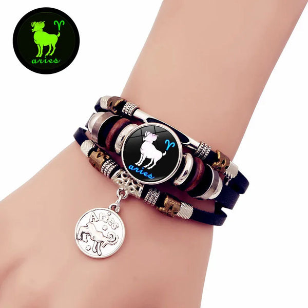 A leather bracelet featuring the Aries zodiac constellation charm on a wrist.