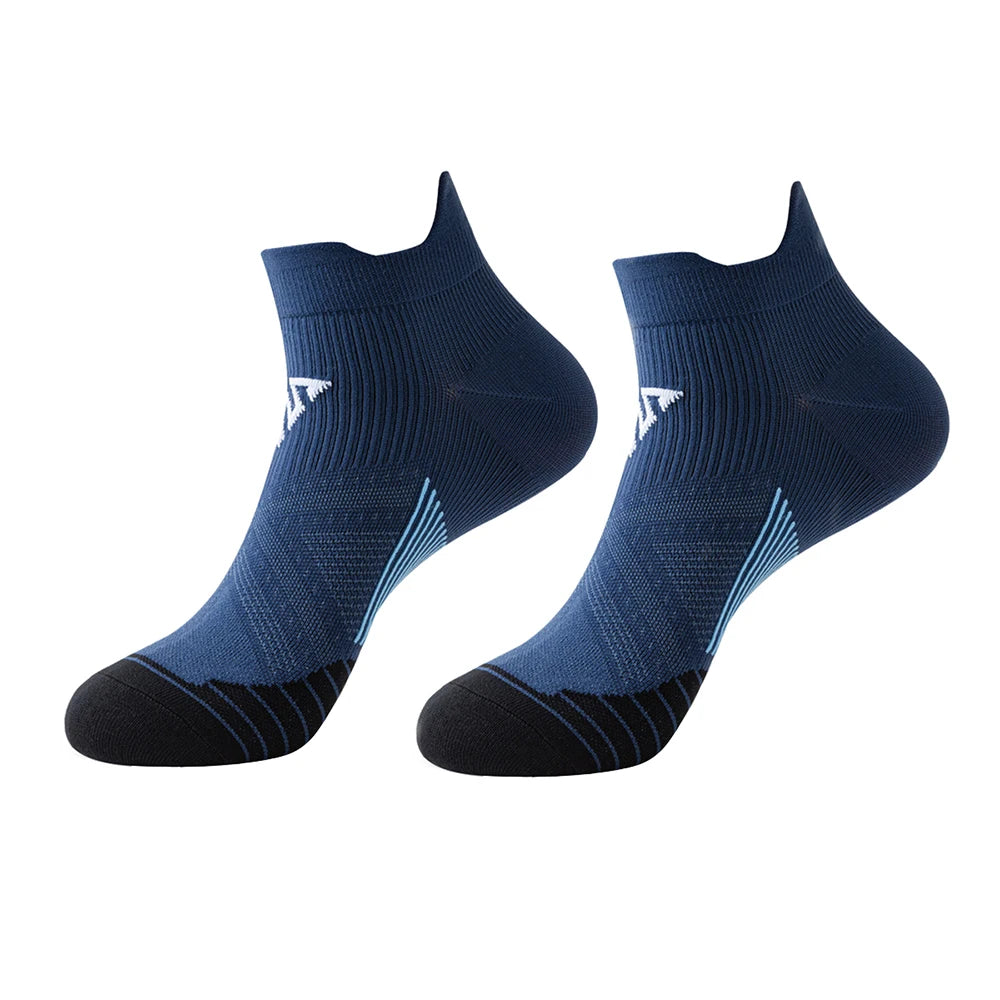 A pair of navy blue breathable anti-blister running socks shown flat.
