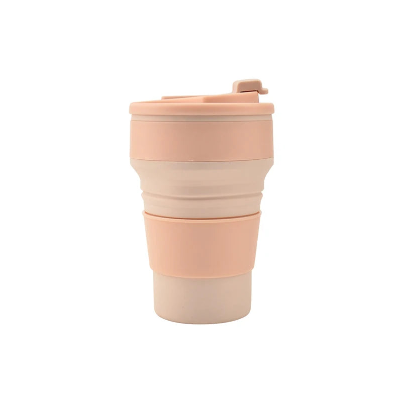 A beige reusable silicone collapsible coffee cup with a matching lid.