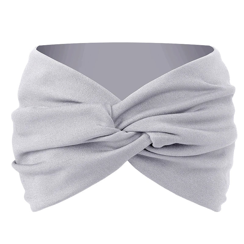 A light gray twisted criss cross elastic headband for yoga and sports