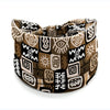 A patterned bohemian stretch cotton headband featuring geometric tribal designs in brown, black, and beige tones.