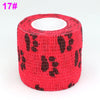 A roll of red elastic bandage tape with a black fruit pattern for joints.