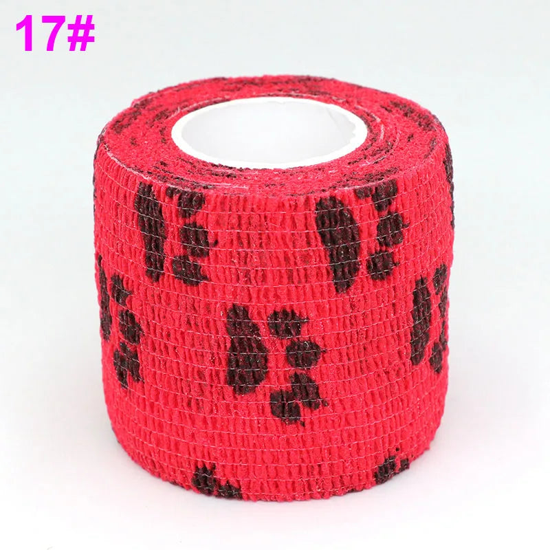 A roll of red elastic bandage tape with a black fruit pattern for joints.