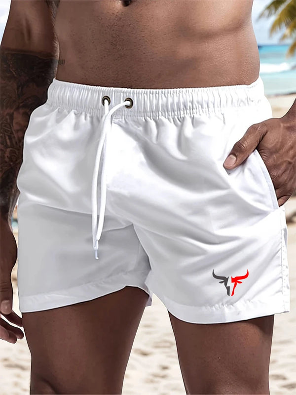 White quick-drying men's swim shorts worn by a person, showing the fabric and design details.