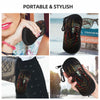 A black silicone pouch designed to hold and protect eyeglasses, featuring a decorative spider web pattern.