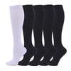 A set of black and white medical grade compression socks for veins and sports
