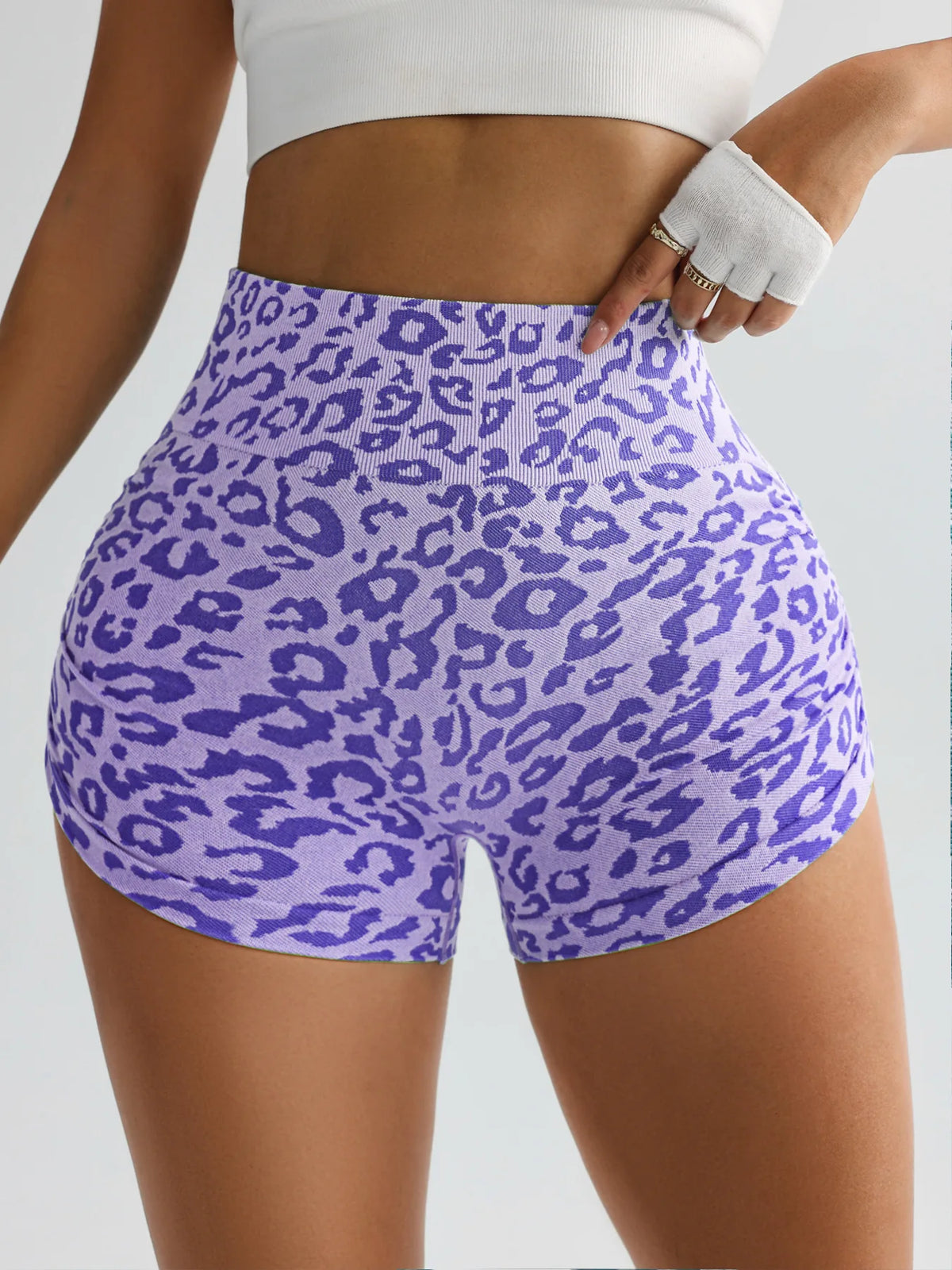 Purple leopard print high-waist seamless shorts worn by a model.