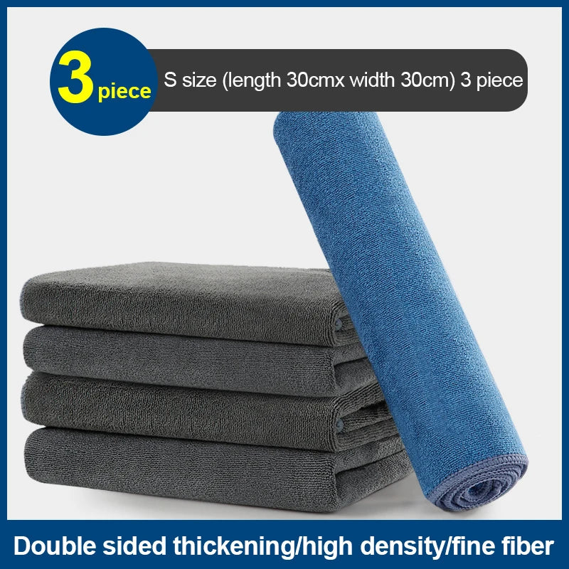 Three blue microfiber car cleaning towels rolled and stacked, showing double-sided thickening and high density.