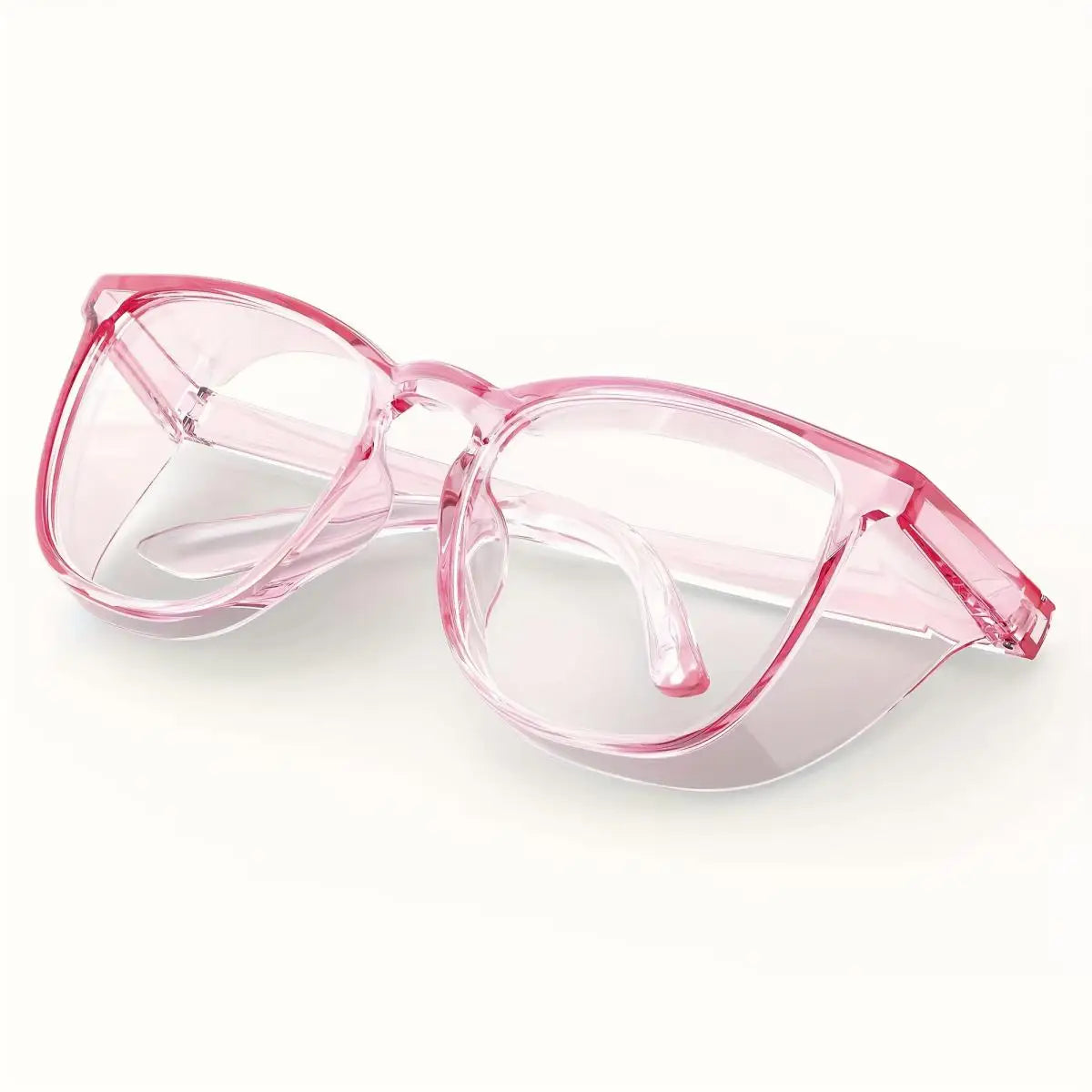 Ein Paar durchsichtige rosa Schutzbrille gegen Nebel, von der Seite betrachtet.