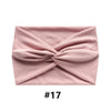 A folded pink boho wide turban headband for women.