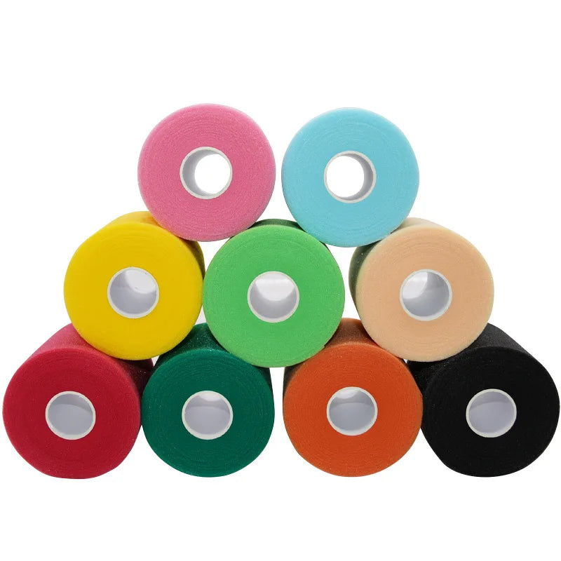 A collection of colorful foam athletic tape wrap rolls in pink, light blue, yellow, green, beige, orange, and black.