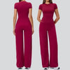 A woman models a magenta high-waist yoga and gym leggings set.