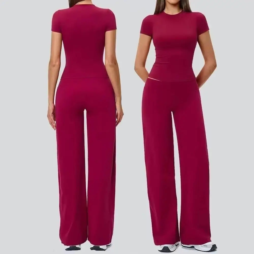 A woman models a magenta high-waist yoga and gym leggings set.